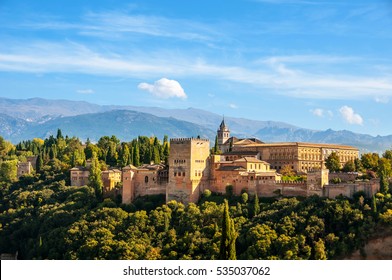 Granada, Spain. Aerial view of Alhambra Palace in Granada, Spain with Sierra Nevada mountains at the background during the sunny day