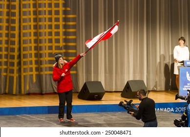 GRANADA, SPAIN - FEBRUARY 4, 2015: opening ceremony of the Winter Universiade 2015, Granada. Flag Bearer and Canadian team during the ceremony