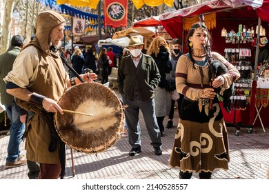 Granada spain, March 12, 2022. A group of medieval street musicians entertain people at a medieval market in Granada. Musicians playing bagpipes and drums.
