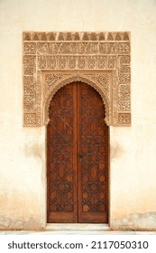 GRANADA - SPAIN - NOVEMBER 29, 2021: Ornate Moorish door in Nasrid Palace Alhambra.                             