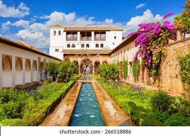 Granada, Spain - October 03, 2013: General view of The Generalife courtyard, with its famous fountain and garden. Alhambra de Granada complex