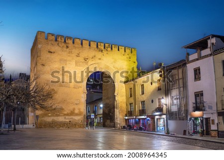 Granada, Spain. View of historic Gate of Elvira (Puerta de Elvira) at dusk