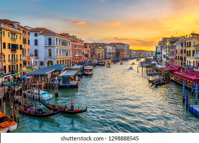 Grand Canal with gondolas in Venice, Italy. Sunset view of Venice Grand Canal. Architecture and landmarks of Venice. Venice postcard
