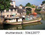 Grand Canal in Wuxi, China. The Grand Canal is the longest canal or artificial river in the world.