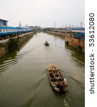 Grand Canal in Wuxi, China. The Grand Canal is the longest canal or artificial river in the world.