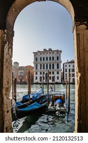 Grand Canal,Venice,Italy.Typical boat transportation.View of gondola,Venetian tourist attraction.Water transport.Travel urban scene.Popular travel destination.Old houses and palaces along canal 