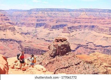 Grand Canyon Hiking People. Hiker Couple Enjoying Hike And View On South Kaibab Trail, South Rim Of Grand Canyon, Arizona, USA.