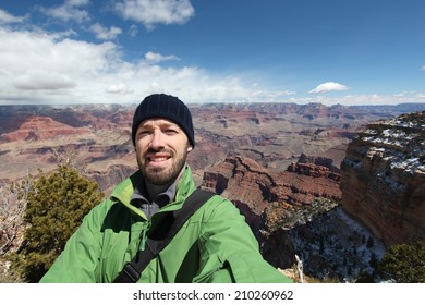 Grand Canyon National Park In Arizona, United States. Tourist Taking A Selfie Photo During A Hike. Young Adult Male Traveler.