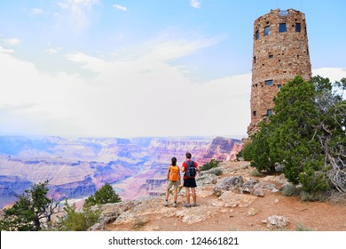 Grand Canyon People Hiking. Hiker Couple Enoying View. Indian Desert View Watchtower, South Rim Of Grand Canyon, Arizona, USA