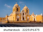 The grand cathedral with its bright yellow shade and white ornaments, Trujillo, Peru