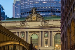 Grand Central Terminal In New York City At Dusk With Surrounding Buildings And Bridge