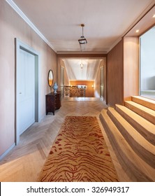 Grand corridor with parquet floor in luxury mansion 