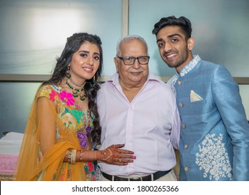 Grand Father With His Grand Daughter And Grand Son In Traditional Outfits On The Wedding Day Of His Grand Daughter Is All Smiles And Love