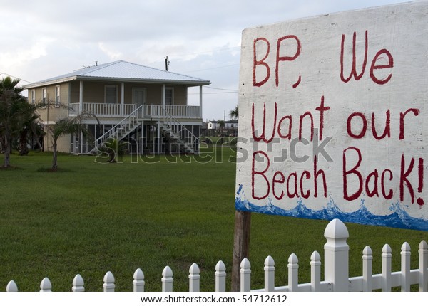 GRAND ISLE, LA - JUNE 5: A sign on the front\
lawn of a home on June 5, 2010 in Grand Isle, LA. The BP oil spill\
that began April 20th, 2010, has resulted in oil washing up on the\
shores of Louisiana.