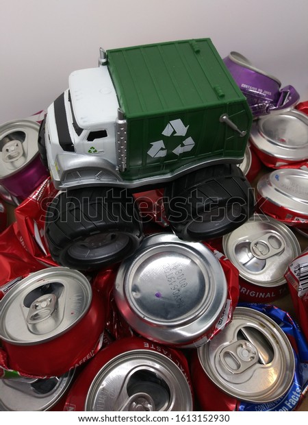 Grand Junction, CO / USA - January\
11 2020: A Monster Recycling Truck crushing aluminum\
cans
