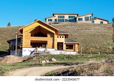 Grand Lake, Colorado, USA, May 2022, New Modern Wood Frame Log Cabin Style Home Under Construction On Hill In Rural Area