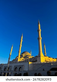 Grand Mosque with Multiple Minarets under Clear Blue Sky in Turkey