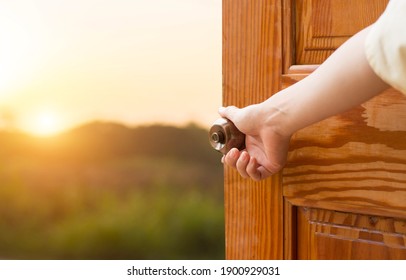 Grand opening women hand open door knob or opening the door, grand opening, Close up hand open door. - Shutterstock ID 1900929031