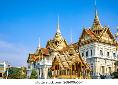 The Grand Palace was built same time as Bangkok. royal residences include Dusit Maha Prasat Throne Hall, Aphorn Phimok Prasat Throne Hall, Phiman Rattaya Throne Hall, Chakri Maha Prasat Throne Hall.The Grand Palace was built by King Rama I (Phra Phutthayodfa Chulalok) concurrently with the founding of Bangkok. It covers an area of ​​152 rai and 2 ngan (approximately 60 acres). Initially, it consisted of three parts: the Grand Palace, the Royal Residence, and Wat Phra Sri Rattanasadaram (Temple of the Emerald Buddha). Historically, temples were built within the grounds of the monarch's residence, similar to the Wat Phra Sri Sanphet in the Ayutthaya period. Therefore, the palace shares a similar architectural style with the construction of Wat Phra Sri Rattanasadaram. Later, during the reigns of King Rama IV and King Rama V, Western influences began to take hold, resulting in a more blended Western architectural style.