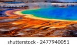 Grand Prismatic Spring in Yellowstone National Park with tourists viewing the spectacular natural scene