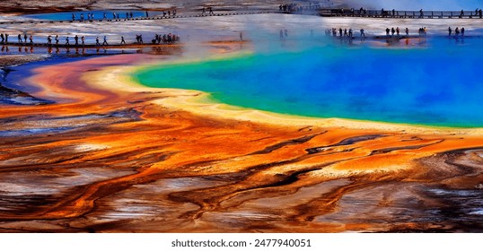 Grand Prismatic Spring in Yellowstone National Park with tourists viewing the spectacular natural scene