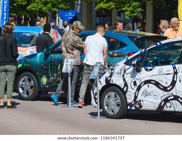 Grand Rapids,\
Michigan / United States - September 22, 2018:  People enjoying the\
car art exhibits at Art\
Prize