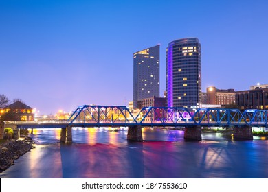Grand Rapids, Michigan, USA downtown skyline on the Grand River at dusk. - Shutterstock ID 1847553610