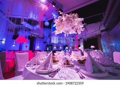A Grand restaurant and a ballroom in a luxury hotel. The interior design is executed in classical style.