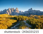 Grand rocky massif in the Italian Alps on a sunny day. Location place National Park Tre Cime di Lavaredo, Sexten Dolomites of northeastern Italy, South Tyrol, Europe. Discover the beauty of earth.