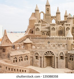 Grand sandcastle on the beach during a summer day