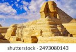 A grand view of the Great Sphinx of Giza with scaffolding for restoration work on a bright hot day on the Giza plateau near Cairo,Egypt