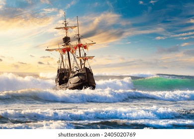 Grand view of an old sailing ship from the times of pirates and the Middle Ages on the high seas with big waves and with a beautiful sky - Powered by Shutterstock