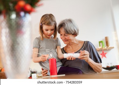 Grandchild And Grandma With Candle