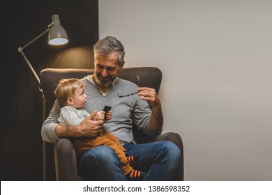 granddad and his grandson using tablet at home - Powered by Shutterstock