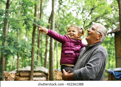 Granddaughter with cute little granddaughter  enjoying in the woods. 