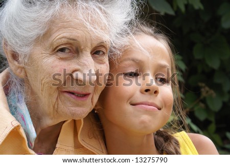 Similar – Grandma cuddles up with her grandson