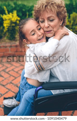 Granddaughter hugging her grandmother