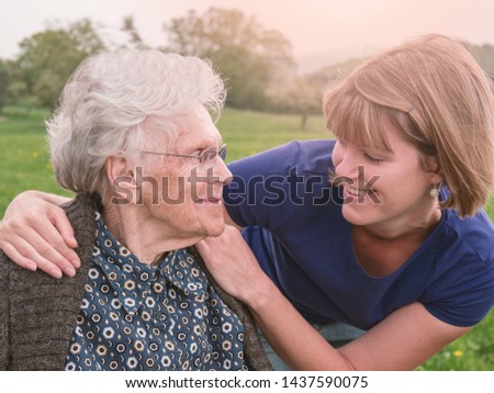 Similar – Senior woman in a wheelchair with her daughter