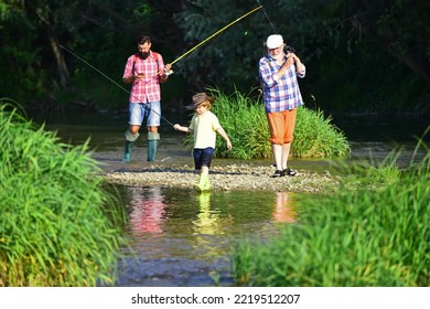 Grandfather, Father And Son Are Fishing On River. Generations Men. Hobby And Sport Activity.