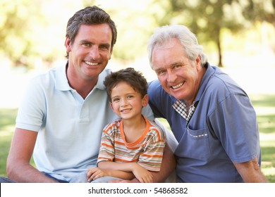 Grandfather With Father And Son In Park