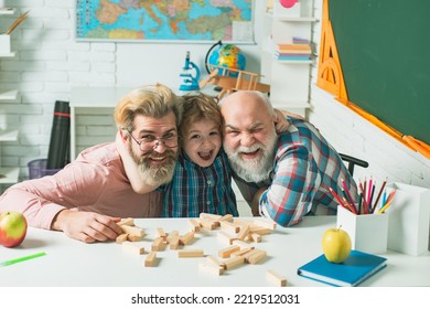 Grandfather Father And Son Playing Games, Men Generation, Happy Little Boy Embrace Young Father And Elderly Grandfather. Three Different Generations Ages Grandfather Father And Child Son Study.