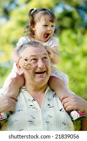 The Grandfather With Grand Daughter In Park