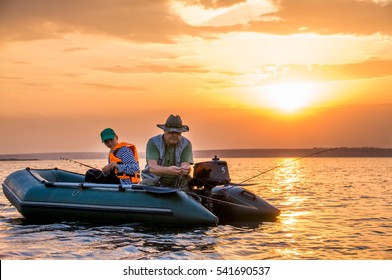 Grandfather And Granddaughter Fishing