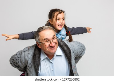 Grandfather With The Granddaughter Isolated On White Background