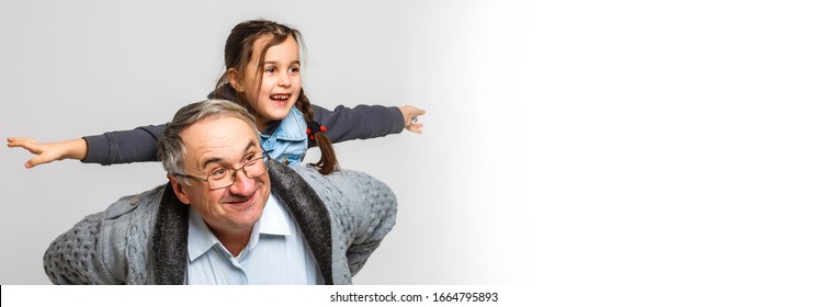 Grandfather With The Granddaughter Isolated On White Background