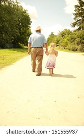a Grandfather and granddaughter are on the road