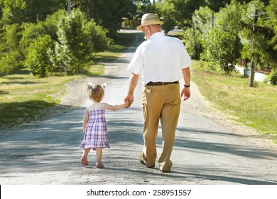 a grandfather and granddaughter are on the road