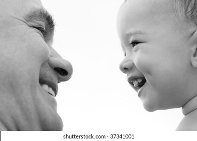 Grandfather And Grandson. Black And White. Focus On Child