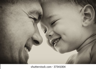 Grandfather And Grandson. Black And White. Focus On Child