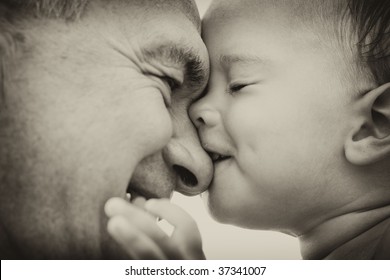 Grandfather And Grandson. Black And White. Focus On Child